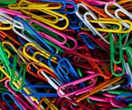 Colorful heap of paper clips - good office background